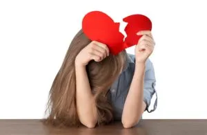 woman-ripping-up-a-paper-heart-isolated-300x195
