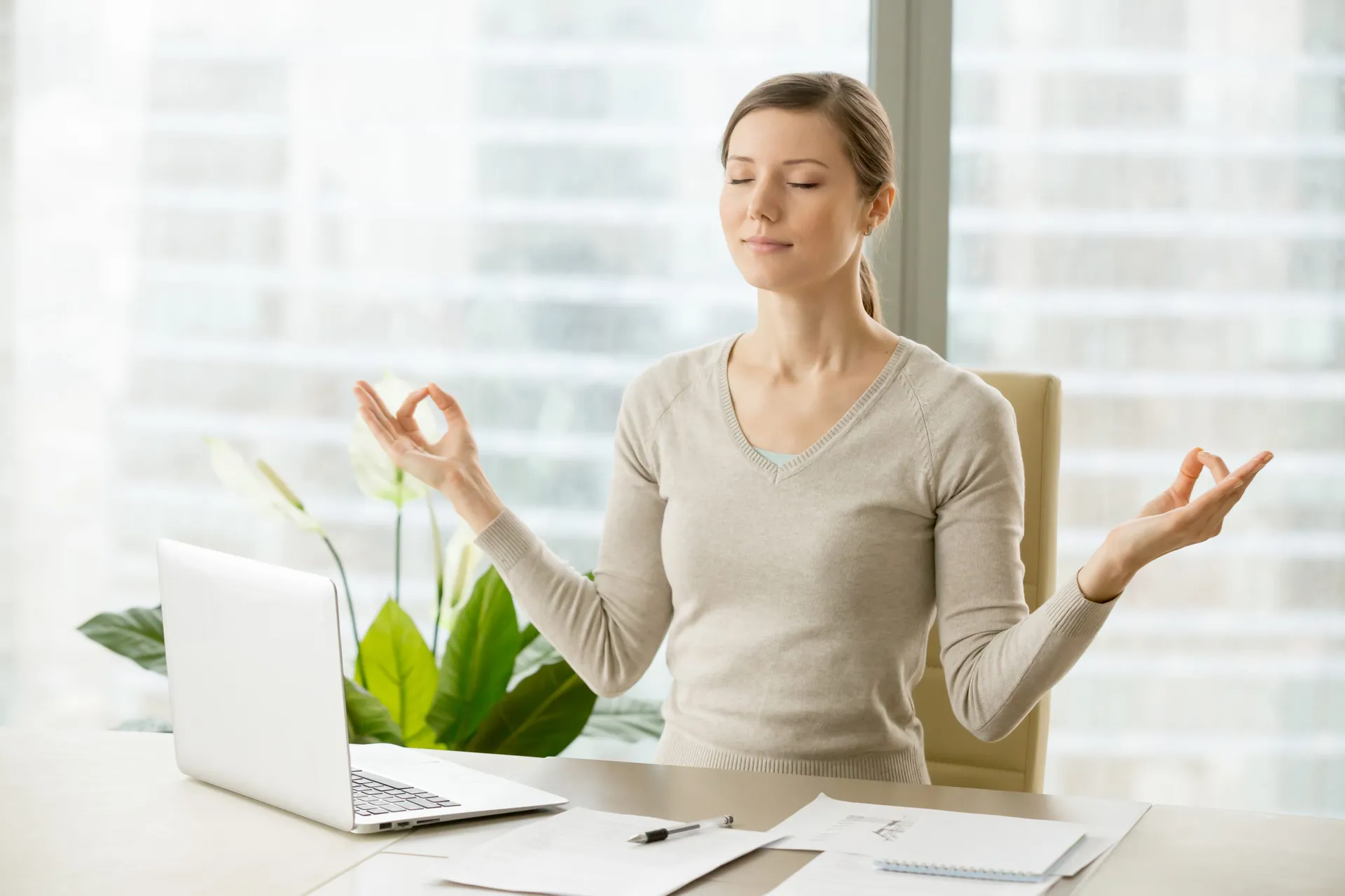 calm-businesswoman-relaxing-with-breath-gymnastics-scaled