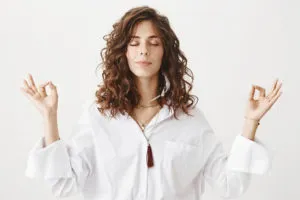 stylish-young-woman-meditating-practice-yoga-breathing-300x200