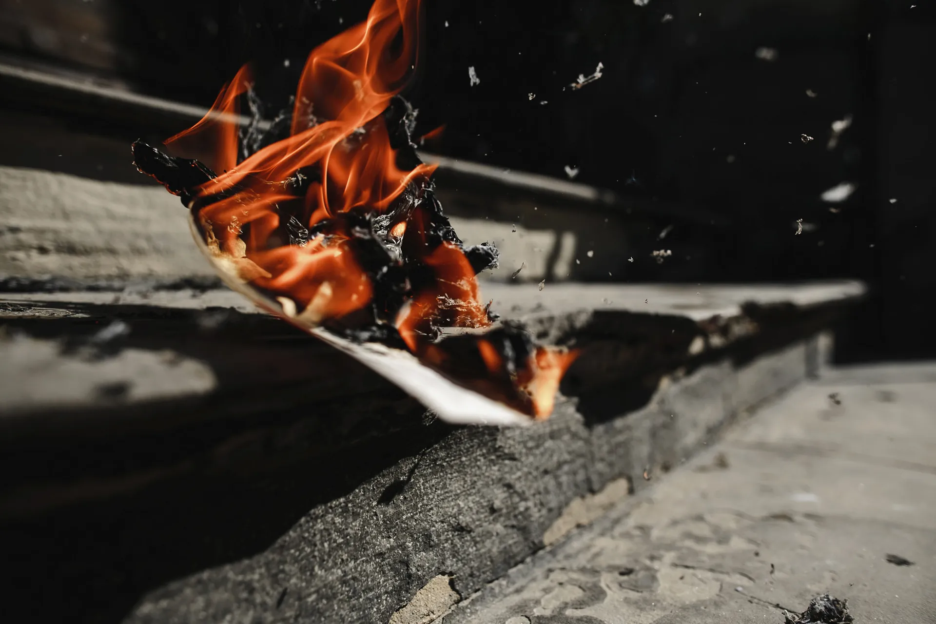 newspaper-is-burning-outdoors-on-the-stairs-scaled