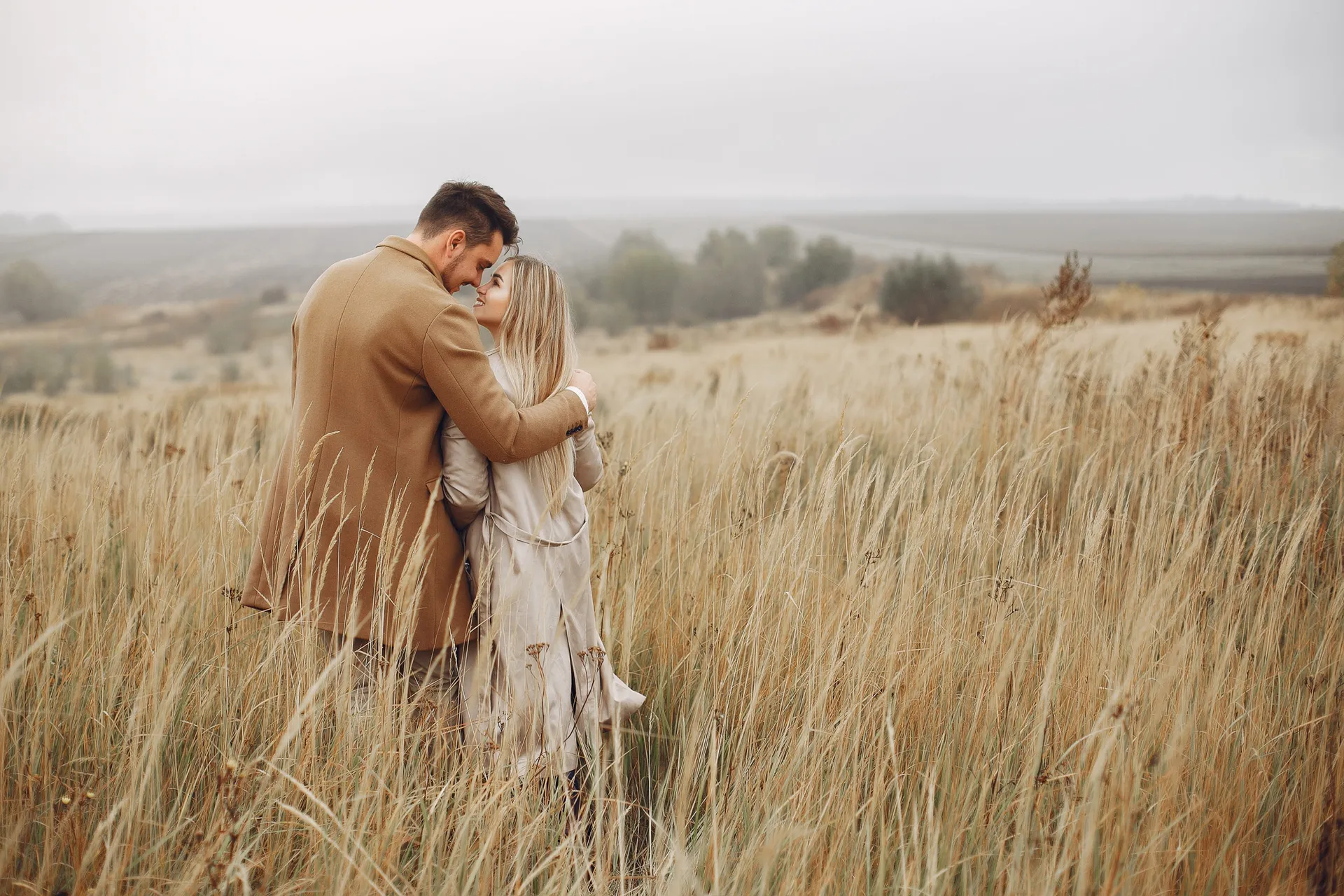 beautiful-couple-spend-time-in-a-autumn-field-scaled