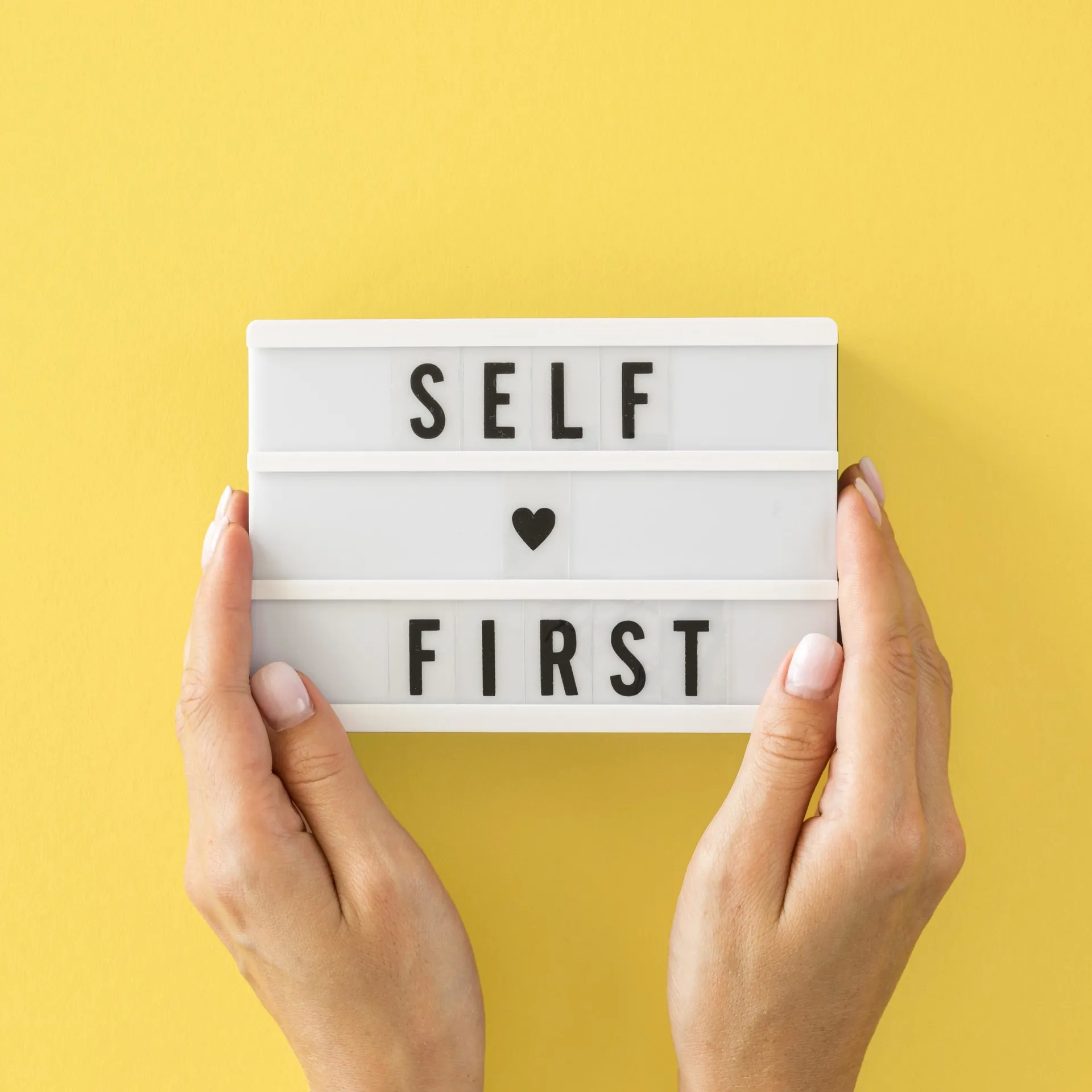 close-up-hands-holding-message-board-scaled